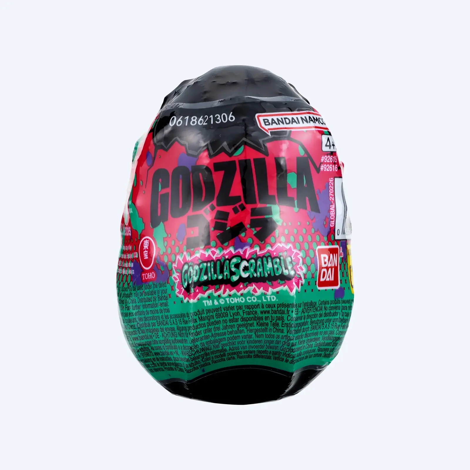 Huevo de Godzilla Scramble de Bandai con su envoltorio termoencogible impreso en rosa y verde
