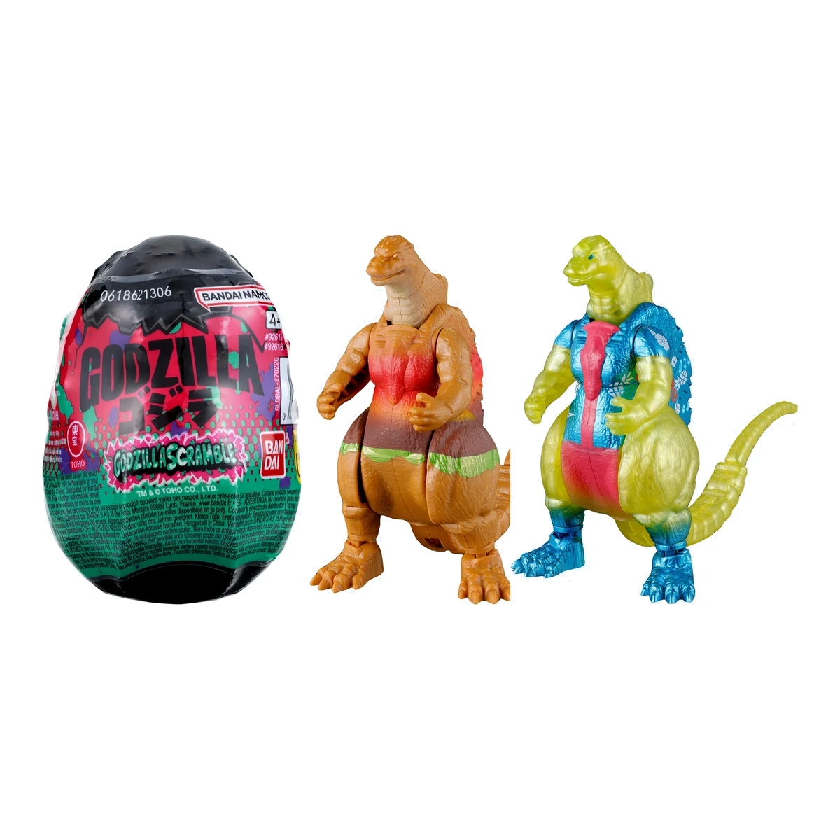 Godzilla Scramble Wave 1 de Bandai: el huevo blind con su envoltorio junto a las figuras Hamburger y el chase Hawaiian Shirt desplegadas