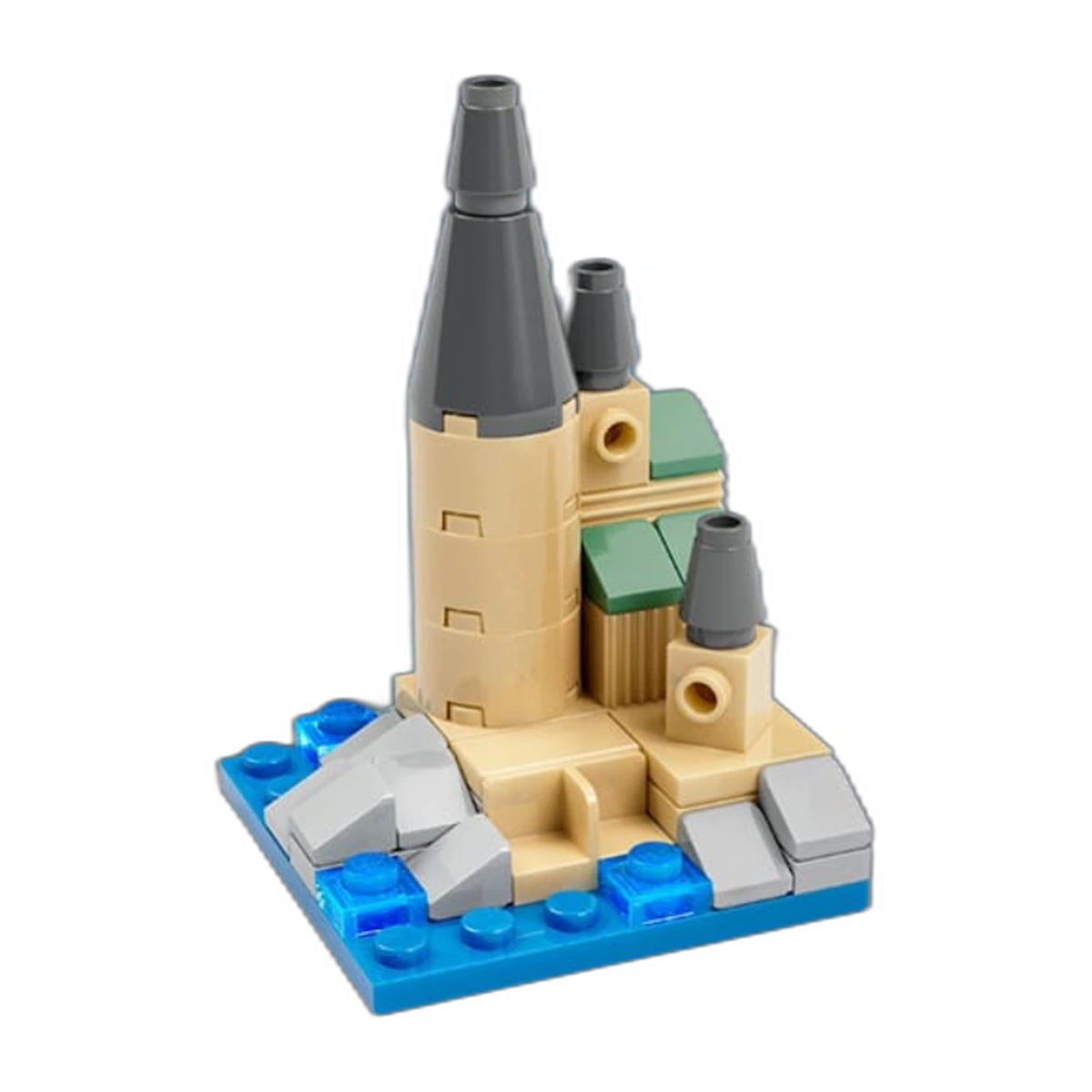 LEGO Mini Castle del Make and Take de septiembre de 2026: castillo a microescala con torres tan, agujas grises y agua azul sobre base de 6x6 studs