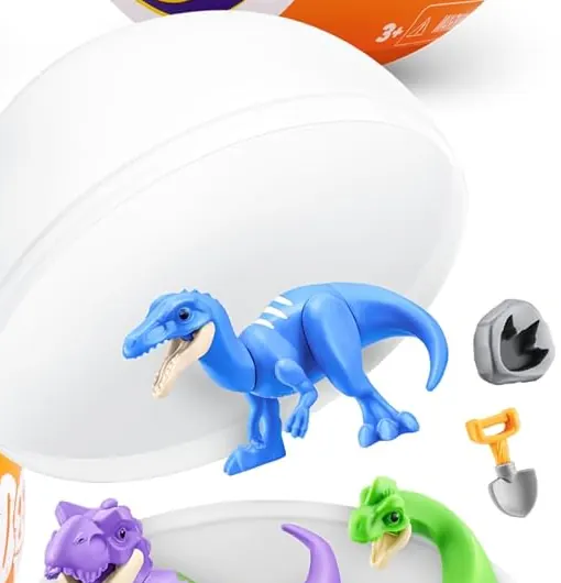 Cápsula 5 Surprise Dinos abierta con un dinosaurio azul, una roca fósil gris y una pala naranja en miniatura