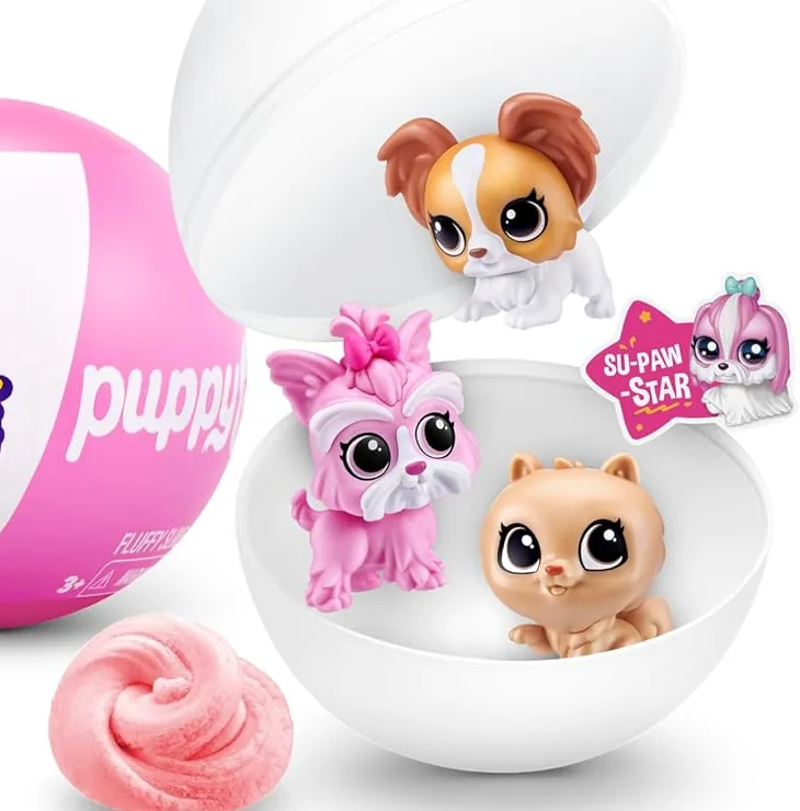 Cápsula de ZURU 5 Surprise Puppy Pet Shop abierta con tres cachorros, la pegatina SU-PAW-STAR y el slime rosa