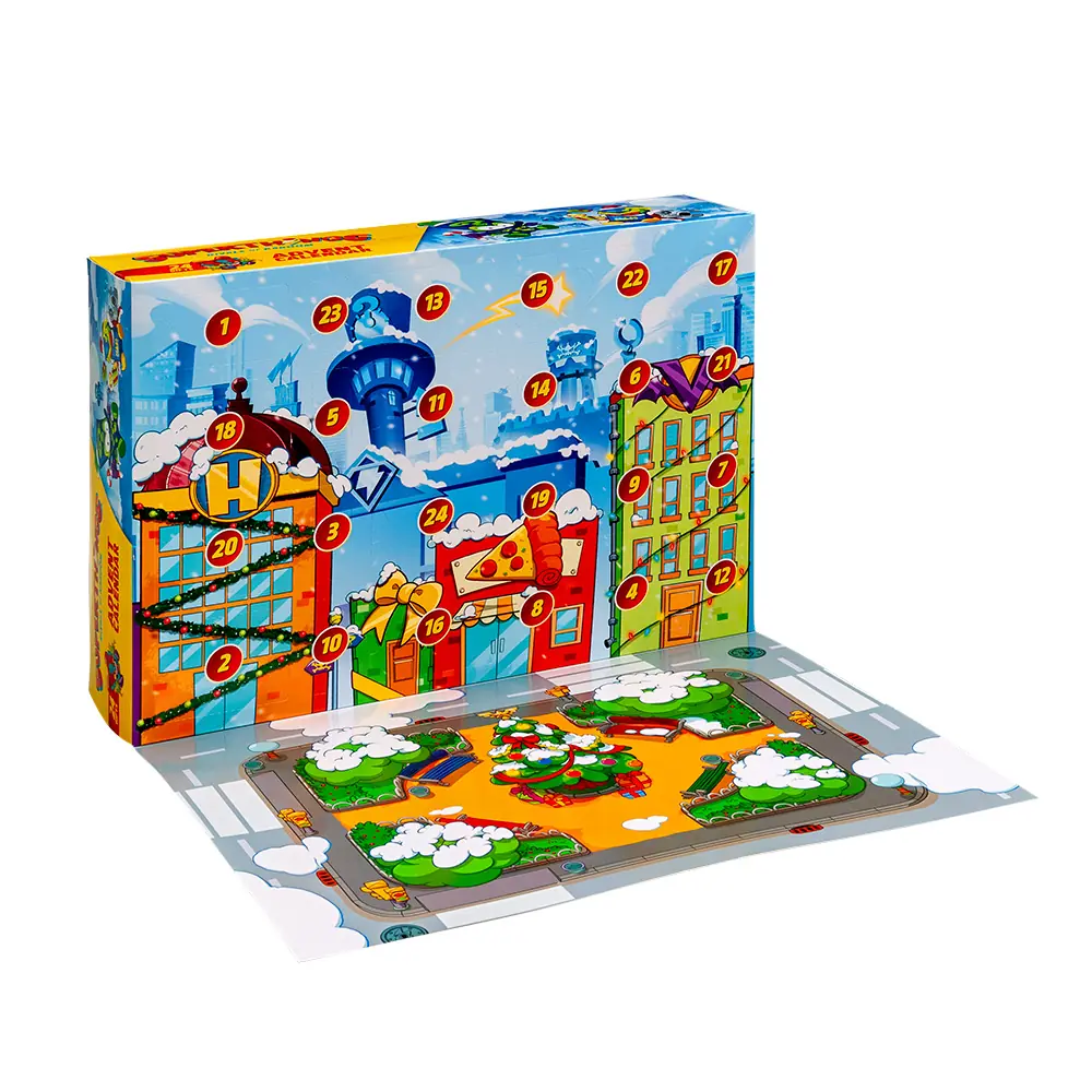 Calendario de Adviento SuperThings 2026 abierto con el tapete de juego de Kaboom City desplegado