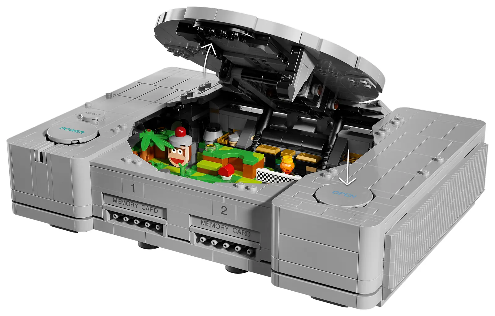 Tapa del lector abierta en el set LEGO PlayStation 72306, con los dos dioramas encajados dentro de la carcasa