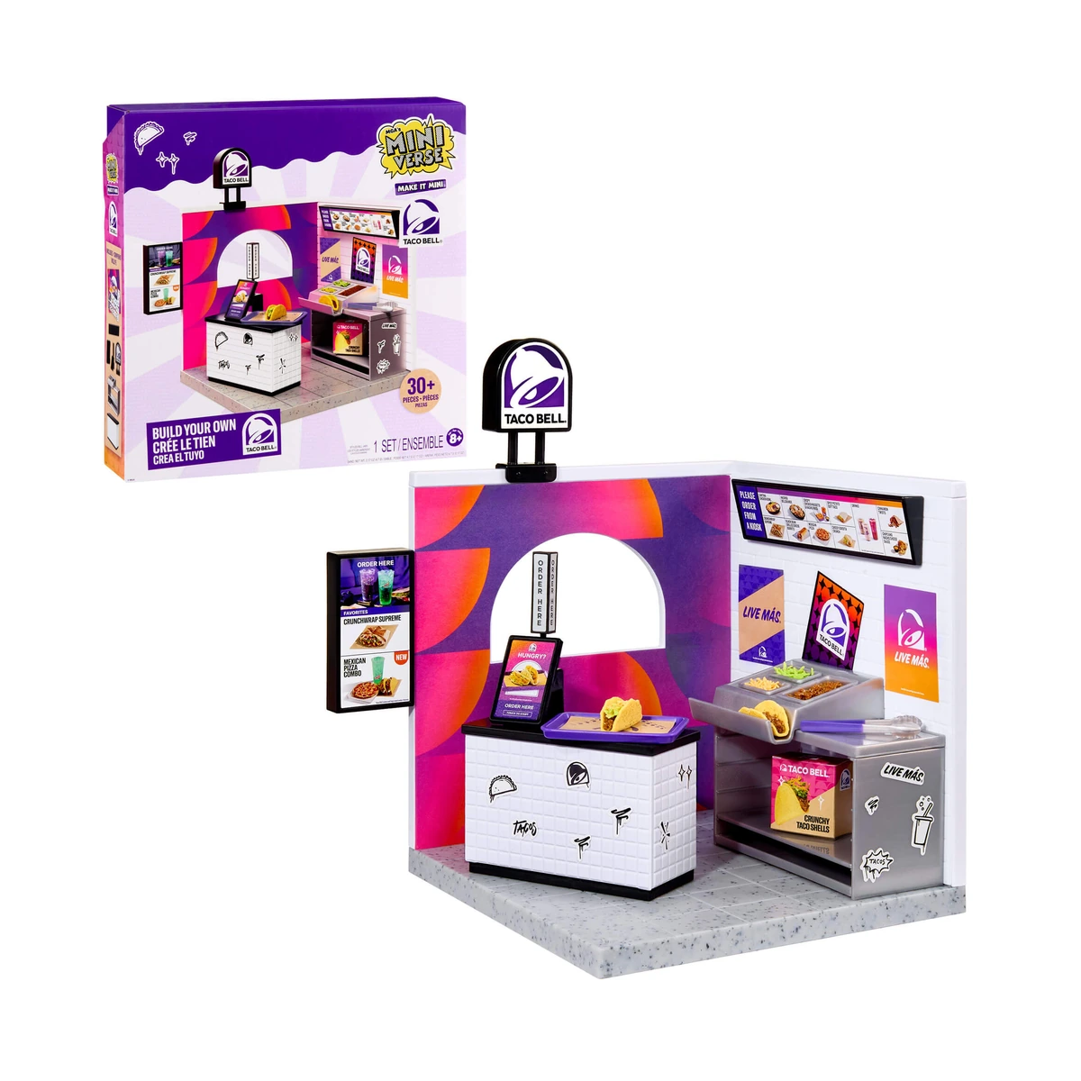 Miniverse Taco Bell Restaurant: caja del playset Make It Mini de MGA junto al restaurante montado con mostrador, menús y estación de tacos