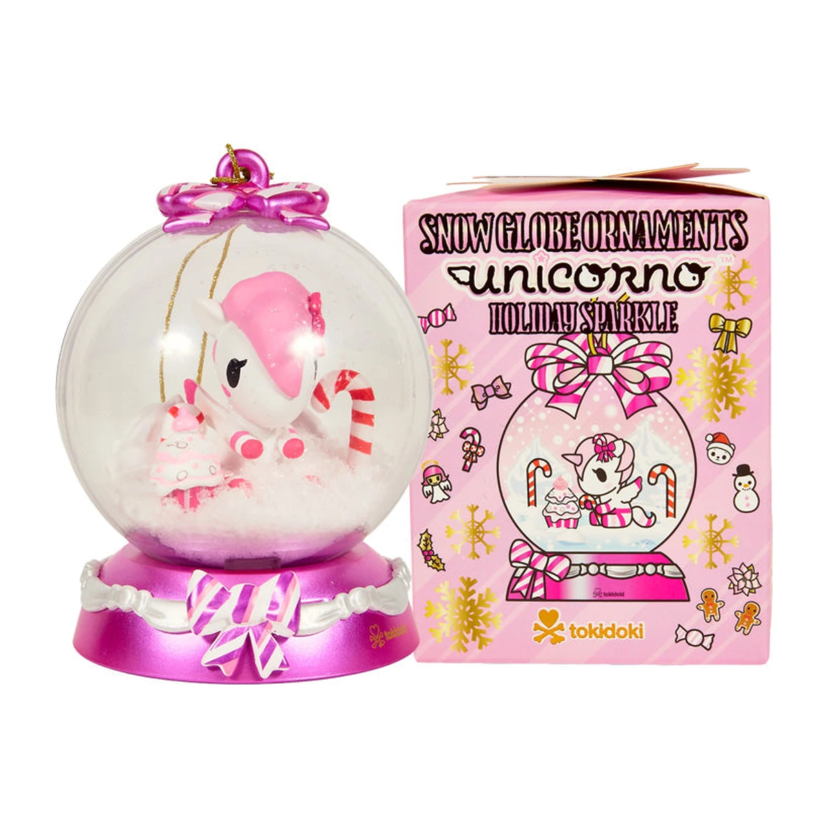tokidoki Unicorno Snow Globe Ornaments Holiday Sparkle: la bola de nieve Candy Cane Lane junto a su caja sorpresa rosa